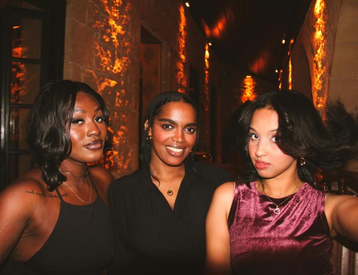 An unprofessional CV photo showing the candidate at a party with other people