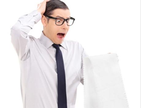 Man looking shocked at a long piece of paper to illustrate CV length